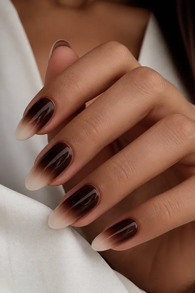 Nails are deep dark brown like chocolate. The tips fade into a creamy off-white "marshmallow" color, with a glossy finish.